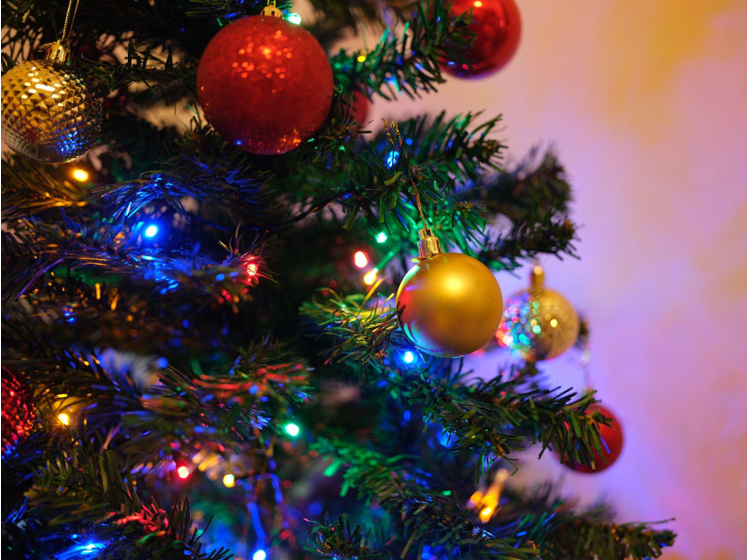Celebrate Christmas with Affordable Trees and Shimmering Gold Ornaments